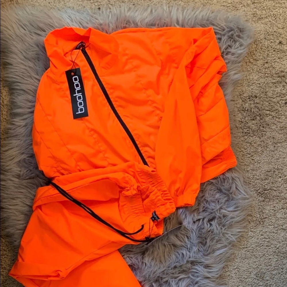 Neon orange cropped jacket, and pants